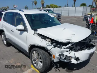 2014 Volkswagen Tiguan SEL with VIN WVGAV3AX9EW512956, listed as a IAAI auction lot 42110002 with 136,034 mi miles and . Bid and sale history available at DreamBid. Image 6.