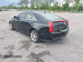 2014 Cadillac ATS Luxury AWD with VIN 1G6AH5RX5E0105296, listed as a IAAI auction lot 42534349 with 219,887 mi miles and . Bid and sale history available at DreamBid. Image 3.