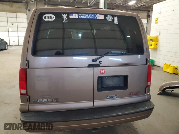 1999 GMC Safari z VIN 1GKEL19W6XB515307, wystawiony jako Copart lot #41521765 z przebiegiem 22 548 mil mil oraz Szkoda całkowita • Salvage title. Historia ofert i sprzedaży dostępna na DreamBid. Obrazek 6.