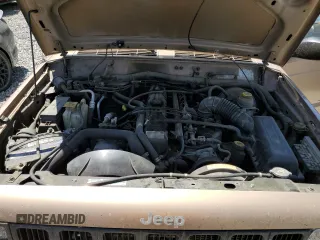 1999 Jeep Cherokee Sport z VIN 1J4FF68S7XL553295, wystawiony jako Copart lot #62390915 z przebiegiem 358 587 mil mil oraz Czysty tytuł • Clean title. Historia ofert i sprzedaży dostępna na DreamBid. Obrazek 12.
