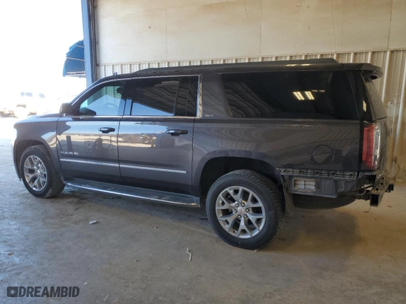 2017 GMC Yukon XL SLT with VIN 1GKS1GKC1HR390673, listed as a Copart auction lot 79182304 with 165,266 mi miles and Salvage Title. Bid and sale history available at carsss.com. Image 2.
