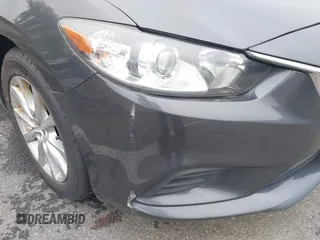 2014 Mazda 6 i Sport with VIN JM1GJ1U52E1102800, listed as a IAAI auction lot 42266283 with 103,886 mi miles and . Bid and sale history available at DreamBid. Image 13.