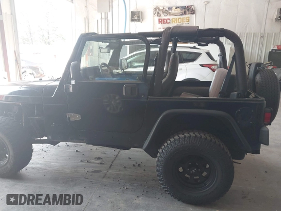 1999 Jeep Wrangler Sport with VIN 1J4FY19S4XP494405, listed as a IAAI auction lot 42542416 with 168,856 mi miles and . Bid and sale history available at DreamBid. Image 14.