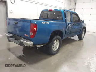 2011 GMC Canyon SLT with VIN 1GTH6NFP8B8115436, listed as a IAAI auction lot 41676023 with 148,478 mi miles. Bid and sale history available at carsss.com. Image 4.