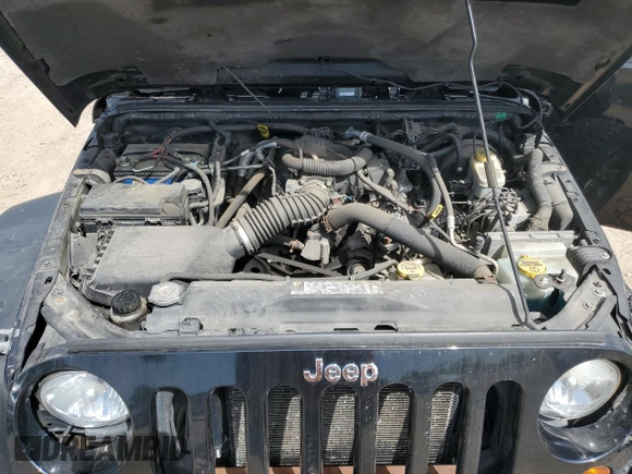 2011 Jeep Wrangler Unlimited Rubicon with VIN 1J4BA6H16BL561658, listed as a Copart auction lot 58379755 with 103,587 mi miles and Salvage title. Bid and sale history available at DreamBid. Image 11.