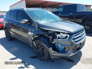 2017 Ford Escape Titanium with VIN 1FMCU0J97HUE07747, listed as a IAAI auction lot 41977788 with 104,560 mi miles. Bid and sale history available at carsss.com. Image 1.