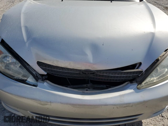 2002 Toyota Camry XLE z VIN 4T1BF32K22U532171, wystawiony jako Copart lot #54527965 z przebiegiem 165 637 mil mil oraz Szkoda całkowita • Salvage title. Historia ofert i sprzedaży dostępna na DreamBid. Obrazek 11.