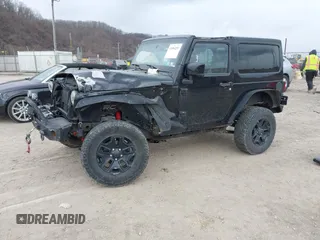 2014 Jeep Wrangler Sahara with VIN 1C4AJWBG9EL311477, listed as a IAAI auction lot 41884255 with 82,221 mi miles and . Bid and sale history available at carsss.com. Image 2.