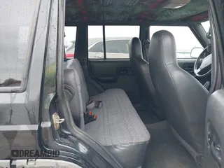 1999 Jeep Cherokee Sport with VIN 1J4FT68S6XL598558, listed as a IAAI auction lot 41549504 with 238,004 mi miles. Bid and sale history available at carsss.com. Image 8.