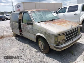 1987 Dodge Caravan z VIN 2B4FK41G3HR127301, wystawiony jako IAAI lot #42393563 z przebiegiem Nie podano mil oraz . Historia ofert i sprzedaży dostępna na DreamBid. Obrazek 1.