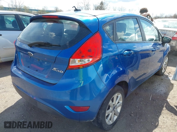 2011 Ford Fiesta SE with VIN 3FADP4EJ0BM173576, listed as a IAAI auction lot 42075691 with 128,835 mi miles. Bid and sale history available at carsss.com. Image 4.