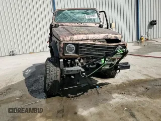 1988 Suzuki Samurai z VIN JS4JC51C6J4271251, wystawiony jako Copart lot #44574795 z przebiegiem 14 542 mil mil oraz Szkody całkowita. Historia ofert i sprzedaży dostępna na DreamBid. Obrazek 11.