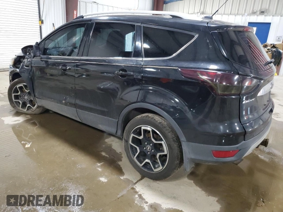 2015 Ford Escape Titanium with VIN 1FMCU9J91FUB77592, listed as a Copart auction lot 62727355 with 94,131 mi miles and Salvage title. Bid and sale history available at DreamBid. Image 2.