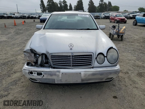 1999 Mercedes-Benz E-Class with VIN WDBJF65H0XA797390, listed as a Copart auction lot 55081405 with 80,950 mi miles and Salvage Title. Bid and sale history available at carsss.com. Image 5.