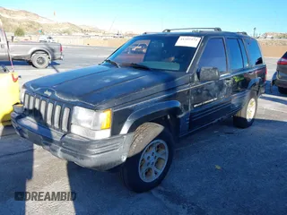 1998 Jeep Grand Cherokee Limited with VIN 1J4GX78Y8WC110325, listed as a IAAI auction lot 41357373 with 165,106 mi miles. Bid and sale history available at carsss.com. Image 19.