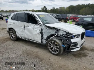 2022 BMW X5 xDrive40i with VIN 5UXCR6C01N9M26766, listed as a Copart auction lot 50990865 with 24,036 mi miles and Salvage Title. Bid and sale history available at DreamBid. Image 4.