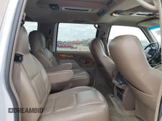 1999 Chevrolet Suburban with VIN 3GNEC16R9XG143471, listed as a Copart auction lot 53856565 with 208,621 mi miles and Salvage title. Bid and sale history available at DreamBid. Image 11.