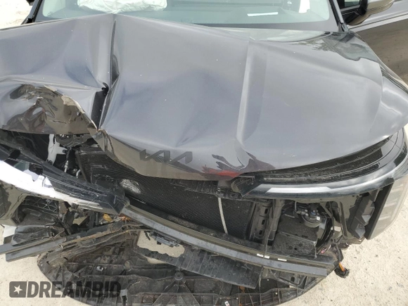 2025 Kia Carnival SX with VIN KNDNE5K37S6490478, listed as a Copart auction lot 51389565 with 6,929 mi miles and Salvage Title. Bid and sale history available at DreamBid. Image 13.
