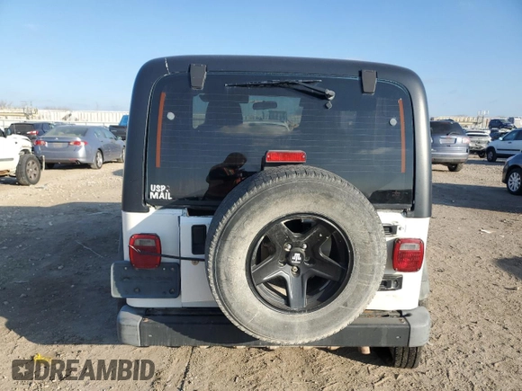 2004 Jeep Wrangler Sport Right Hand Drive with VIN 1J4F449S54P775671, listed as a Copart auction lot 85610114 with 199,074 mi miles and Salvage Title. Bid and sale history available at carsss.com. Image 6.