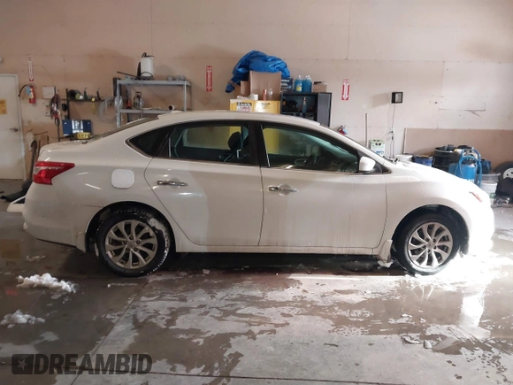 2019 Nissan Sentra S z VIN 3N1AB7AP9KY325065, wystawiony jako IAAI lot #41612204 z przebiegiem 141 818 mil mil oraz . Historia ofert i sprzedaży dostępna na DreamBid. Obrazek 13.