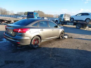2015 Ford Focus SE with VIN 1FADP3F29FL384879, listed as a IAAI auction lot 41335839 with 107,871 mi miles. Bid and sale history available at carsss.com. Image 4.