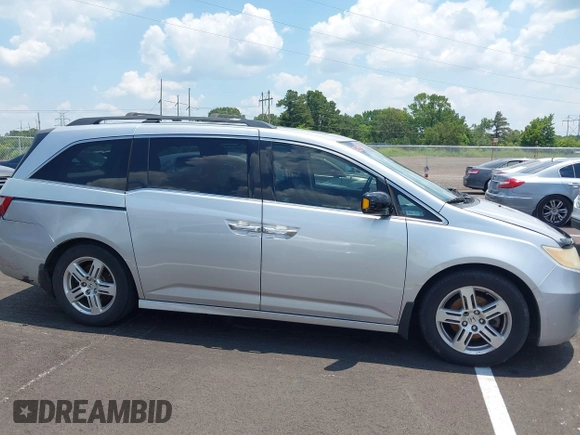 2011 Honda Odyssey Touring with VIN 5FNRL5H99BB058448, listed as a IAAI auction lot 42651432 with 208,581 mi miles and . Bid and sale history available at DreamBid. Image 13.