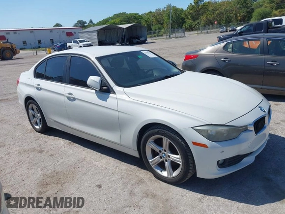 2014 BMW 3 Series 320i with VIN WBA3B1G53ENT00444, listed as a IAAI auction lot 42082984 with 94,401 mi miles. Bid and sale history available at carsss.com. Image 1.