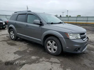 2012 Dodge Journey SXT z VIN 3C4PDDBG7CT183148, wystawiony jako Copart lot #55614685 z przebiegiem 182 263 mil mil oraz Szkoda całkowita • Salvage title. Historia ofert i sprzedaży dostępna na DreamBid. Obrazek 4.