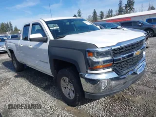 2018 Chevrolet Silverado 1500 LT with VIN 1GCVKREC6JZ266420, listed as a IAAI auction lot 41660687 with 86,656 mi miles and . Bid and sale history available at DreamBid. Image 1.