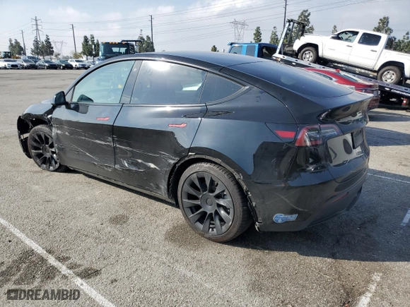2021 Tesla Model Y Long Range with VIN 5YJYGDEE7MF232595, listed as a Copart auction lot 45394895 with 98,129 mi miles and Salvage Title. Bid and sale history available at carsss.com. Image 2.