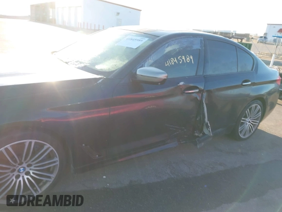 2018 BMW 5 Series M550i xDrive with VIN WBAJB9C59JG463948, listed as a IAAI auction lot 41845989 with 99,385 mi miles. Bid and sale history available at carsss.com. Image 6.