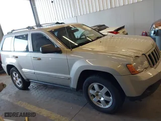 2010 Jeep Grand Cherokee Laredo with VIN 1J4RR4GT9AC106381, listed as a IAAI auction lot 41723268 with 180,008 mi miles. Bid and sale history available at carsss.com. Image 13.