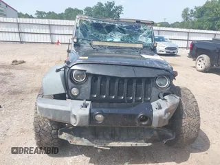 2014 Jeep Wrangler Sport with VIN 1C4AJWAGXEL233647, listed as a IAAI auction lot 39993785 with Not Provided miles and . Bid and sale history available at DreamBid. Image 10.