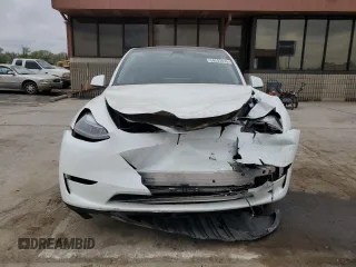 2023 Tesla Model Y Long Range z VIN 7SAYGAEE9PF686434, wystawiony jako Copart lot #54593475 z przebiegiem Nie podano mil oraz Szkoda całkowita • Salvage title. Historia ofert i sprzedaży dostępna na DreamBid. Obrazek 5.