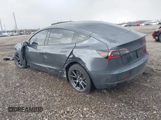 2023 Tesla Model 3 with VIN 5YJ3E1EAXPF693693, listed as a IAAI auction lot 41709704 with 12,473 mi miles and . Bid and sale history available at DreamBid. Image 3.