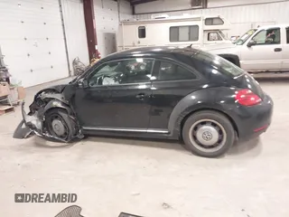 2012 Volkswagen Beetle 2.5L PZEV with VIN 3VWJP7AT3CM623533, listed as a IAAI auction lot 40972471 with 95,906 mi miles. Bid and sale history available at carsss.com. Image 14.