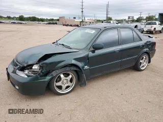 2002 Mazda Protege LX z VIN JM1BJ226920510014, wystawiony jako Copart lot #59285995 z przebiegiem 235 652 mil mil oraz Szkoda całkowita • Salvage title. Historia ofert i sprzedaży dostępna na DreamBid. Obrazek 1.