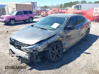 2017 Nissan Maxima SV with VIN 1N4AA6AP6HC433063, listed as a IAAI auction lot 41824120 with 130,692 mi miles and . Bid and sale history available at DreamBid. Image 2.