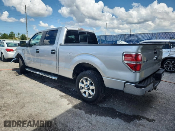 2013 Ford F-150 XL with VIN 1FTFW1CFXDFA77959, listed as a Copart auction lot 62317545 with 132,472 mi miles and Salvage title. Bid and sale history available at DreamBid. Image 2.