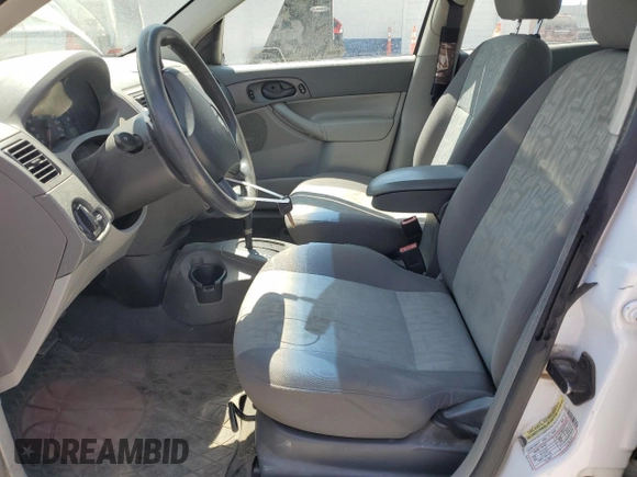 2005 Ford Focus S with VIN 1FAFP34N05W296550, listed as a Copart auction lot 59391835 with 216,509 mi miles and Salvage title. Bid and sale history available at DreamBid. Image 7.
