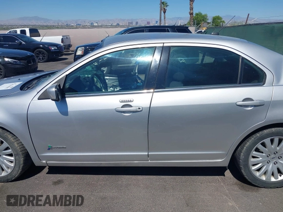 2011 Ford Fusion Hybrid with VIN 3FADP0L31BR190659, listed as a IAAI auction lot 42616065 with 122,095 mi miles and . Bid and sale history available at DreamBid. Image 14.
