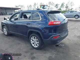 2015 Jeep Cherokee Latitude with VIN 1C4PJLCB5FW694359, listed as a IAAI auction lot 41934213 with 117,723 mi miles and . Bid and sale history available at DreamBid. Image 3.