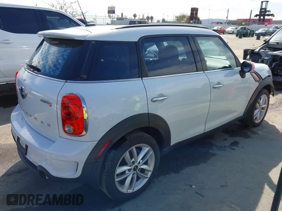 2014 MINI Countryman S with VIN WMWZC3C52EWP26869, listed as a IAAI auction lot 41756310 with 91,941 mi miles and . Bid and sale history available at DreamBid. Image 4.