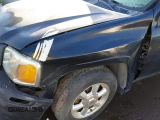 2005 GMC Envoy SLE with VIN 1GKDT13S752161375, listed as a IAAI auction lot 40945627 with 172,757 mi miles. Bid and sale history available at carsss.com. Image 12.
