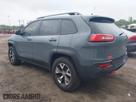 2014 Jeep Cherokee Trailhawk with VIN 1C4PJMBB5EW156315, listed as a IAAI auction lot 42426229 with 154,019 mi miles and . Bid and sale history available at DreamBid. Image 3.