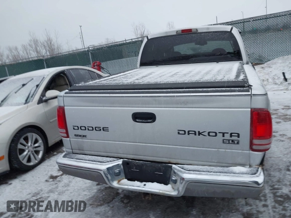 2004 Dodge Dakota SLT with VIN 1D7HG48N34S665027, listed as a IAAI auction lot 41395509 with 128,064 mi miles. Bid and sale history available at carsss.com. Image 16.