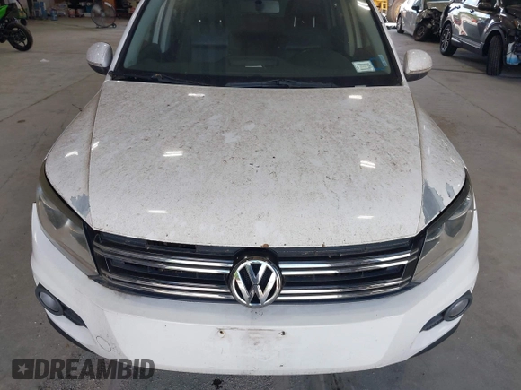 2012 Volkswagen Tiguan SE with VIN WVGAV7AXXCW533237, listed as a IAAI auction lot 42670923 with 227,323 mi miles and . Bid and sale history available at DreamBid. Image 12.