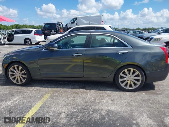 2014 Cadillac ATS Luxury RWD z VIN 1G6AB5RAXE0142079, wystawiony jako IAAI lot #42517963 z przebiegiem 140 118 mil mil oraz . Historia ofert i sprzedaży dostępna na DreamBid. Obrazek 6.