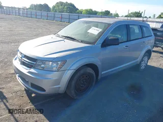 2014 Dodge Journey American Value with VIN 3C4PDCAB2ET259183, listed as a IAAI auction lot 42207868 with 132,564 mi miles and . Bid and sale history available at DreamBid. Image 2.
