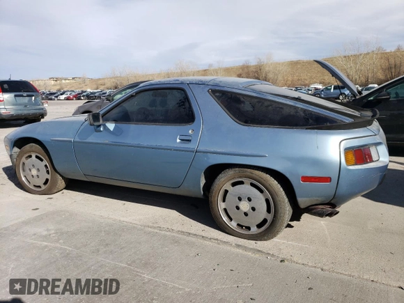 1985 Porsche 928 z VIN WP0JB092XFS860634, wystawiony jako Copart lot #49650775 z przebiegiem 140 644 mil mil oraz Czysty tytuł • Clean title. Historia ofert i sprzedaży dostępna na DreamBid. Obrazek 2.